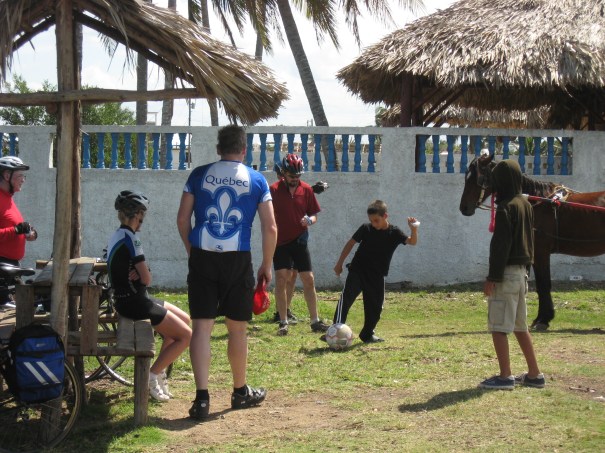 Cyclists and Cubans mix it up with a game of soccer. Doug Taylor (in red shirt) supplied the ball.