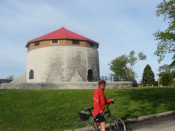 Doug Taylor stops in front of round structure, part of the extensive fortifications of Kingston.