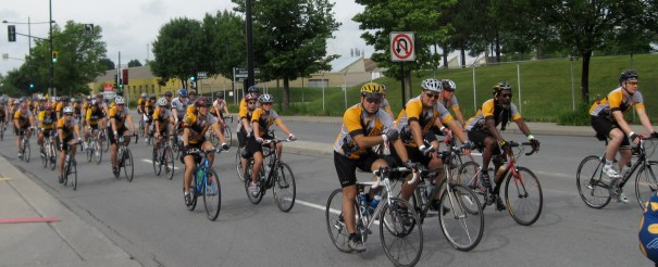 Cyclists ride along Notre Dame Street in cancer event.