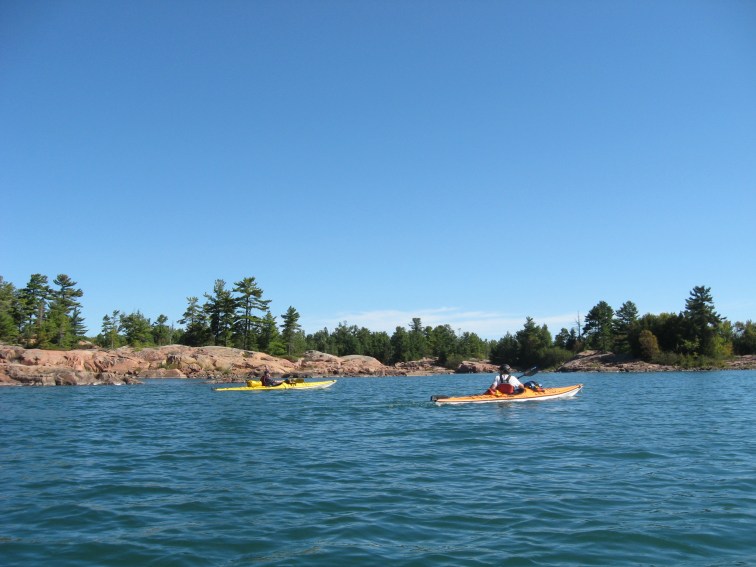 PADDLING ALONG THE SHORE OF PHILIP EDWARD ISLAND